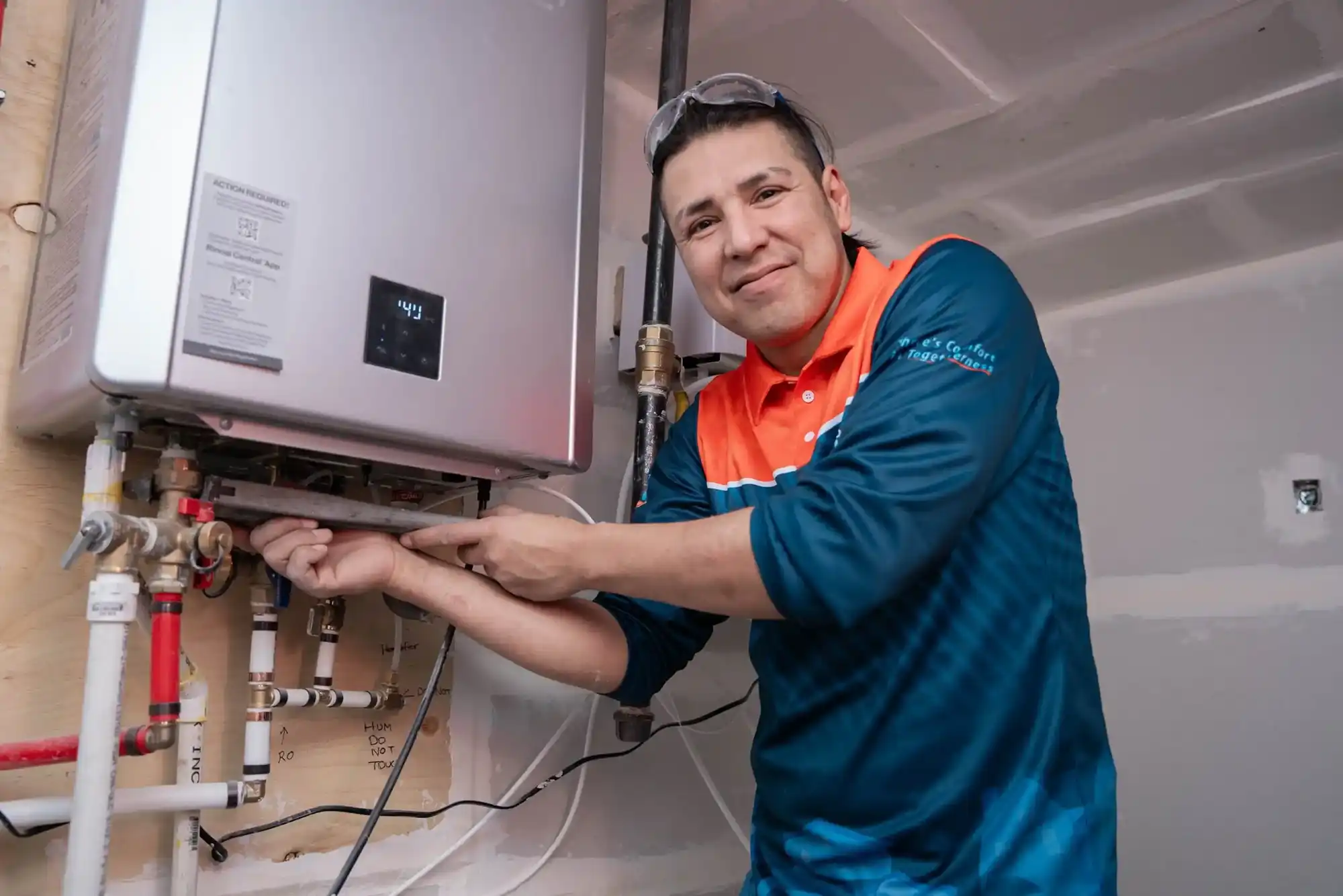 Comfort Union technicians installing water heater in Chestermere, Alberta