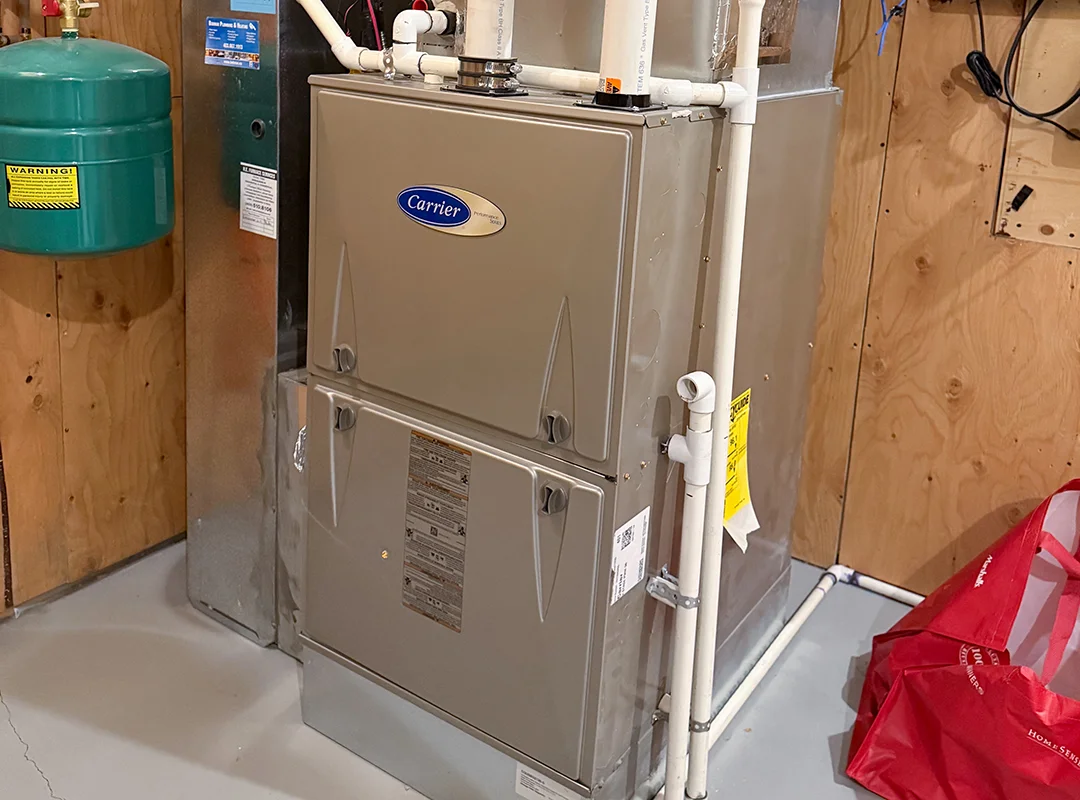 Installed Carrier furnace in basement utility room by Comfort Union
