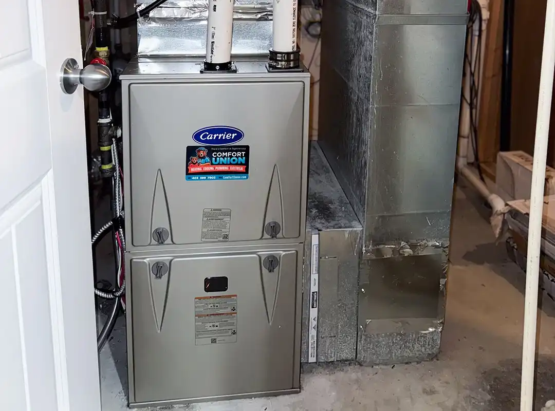 Comfort Union-installed Carrier furnace in home utility room for optimal heat performance